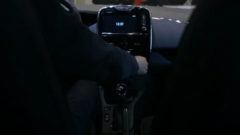 Man starting electric car with touchscreen dashboard, innovative technologies Stock Footage 89995910