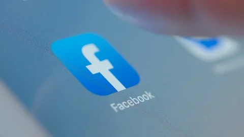 Man Starting Facebook App On Tablet PC Stock Footage 123046335