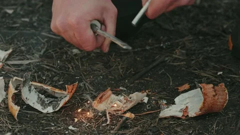 Man Starting A Fire With Ferro Rod (Ferrocerium Rod). Magnesium Rod Stock Footage 238950968