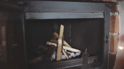 Man is Starting a Fire in a Fireplace. 4K Close Up. 스톡 동영상 66732366