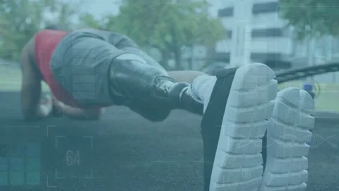 Man starting from forearm plank and lifting prosthetic leg, engaging core for Stock Footage 333145494