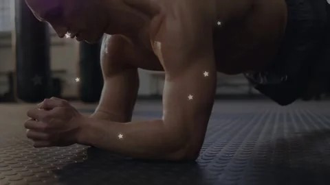 Man starting forearm plank on mat, tensing core for fitness, shifting, stars Stock Footage 334040886