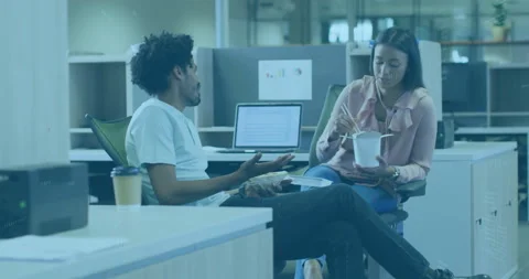 Man starting office lunch chat with woman eating takeout meal as code overlays Stock Footage 310419367