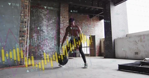 Man starting overhead doing medball slams and rebounds while data charts overlay 스톡 동영상 330652870