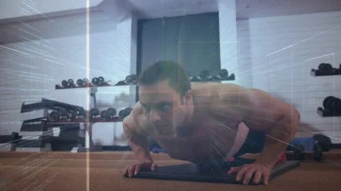 Man starting plank, doing pushups on mat for fitness while animated streaks Stock Footage 331701505