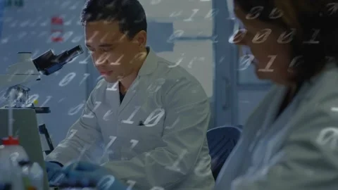 Man starting prep at lab bench, using pipette by microscope, capturing data Stock Footage 335255237