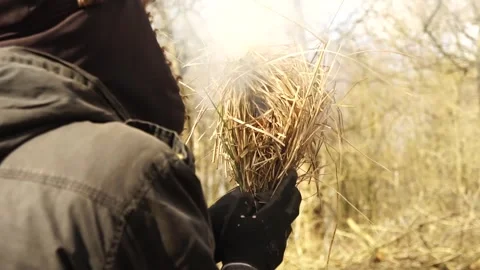 Man Starting Primitive Fire. Starting a Primitive Campfire Stock Footage 306536131