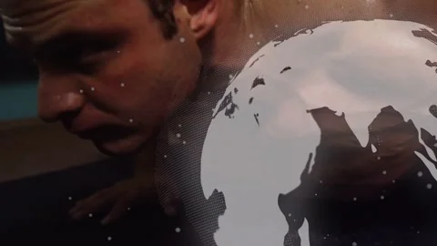 Man starting pushups on mat, globe drifting and partly obscuring subject and Stock Footage 332772271