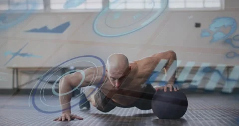 Man starting pushups, shifting weight onto medball, doing reps as blue HUD Stock Footage 330729119