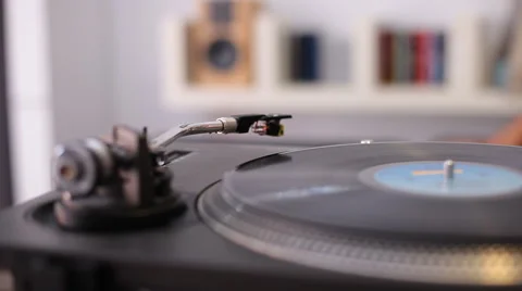 A man starting a retro record player Stock Footage 58336361