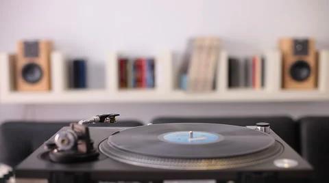 A man starting a retro record player Stock Footage 58341299