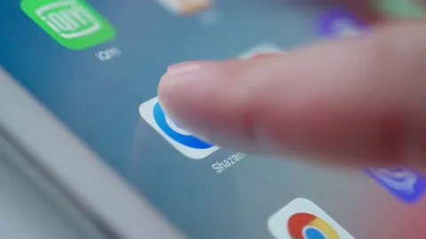 Man Starting Shazam App On Tablet PC Видео 141706030