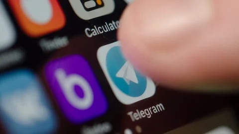 Man starting Telegram app on a smartphone Vídeo Stock 102443504