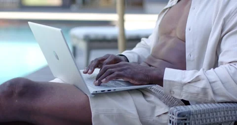 Man is starting to type as hands are touching keyboard, working on laptop at Stock Footage 336484152