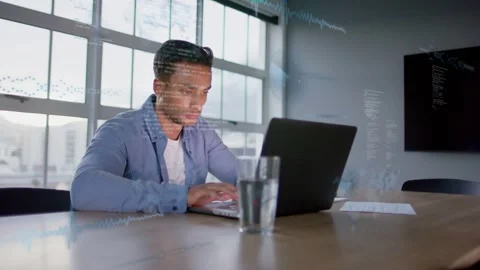 Man starting to type on laptop at conference table, analyzing business data with Stock Footage 335739260