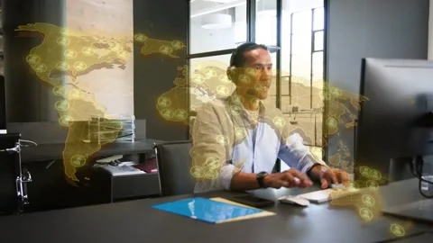 Man starting typing, alternating mouse use and gesturing, tech analyzing global Stock Footage 334322143