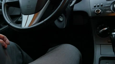 The man starts the car engine 動画素材 57326801