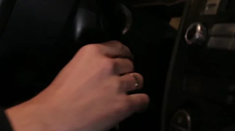 Man starts the car with key close up Stock Footage 62484484