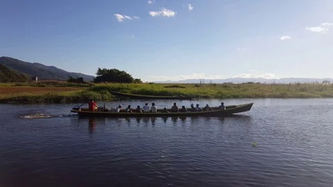 Man starts engine in boat with passengers, boat sails, Inle Lake, Myanmar Video stock 79970458