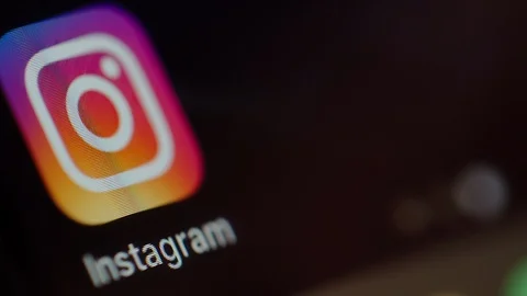 Man starts using Instagram on a smartphone Stock Footage 102443542