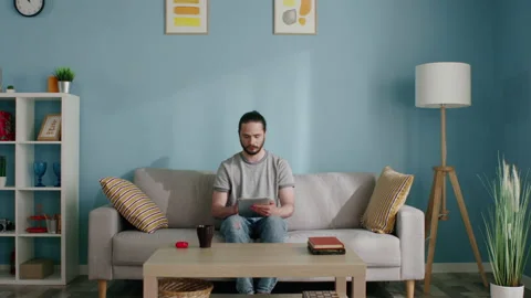 Man Stays Home, Using Gadget Video stock 133380736