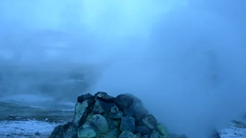 A man at the steaming fumaroles at Hverir or Namafjall geothermal park Stock Footage 281141601