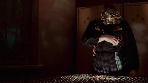 A man with a steampunk mask playing with a machine with some tools in his han Vidéo 259854884