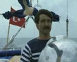 Man steering boat facing camera SD Footage