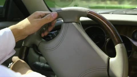 Man is steering the car Stock Footage 238636991