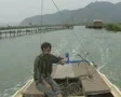 Man steering moving motorboat SD Footage