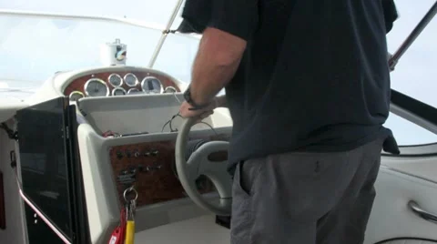 MAN STEERING SPEED BOAT Stock Footage 8575060