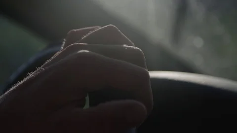 Man steering a wheel in a car Stockbeeldmateriaal 76735217