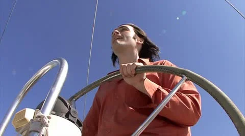 Man steering wheel of the sailboat Stock Footage 10768764
