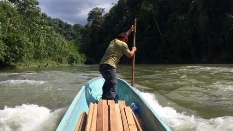 Man Steers Boat Pushing It With Pole Against Current Panama 4k Stock Footage 197015204