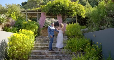 Man stepping closer, touching woman's hair, couple twirling, kissing, hugging, Stock Footage 341736766
