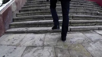 Man stepping on the old stairs, slow motion Stock Footage 85889893
