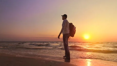 A man steps on the beach Stock Footage 94371056
