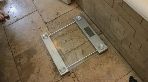 Man Steps on scale 190 lbs Video stock 16828885