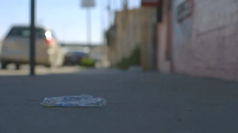 Man Steps on Sidewalk Litter Stock Footage 60129498