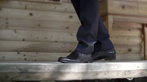 Man steps on wooden floor Stock Footage 64094875