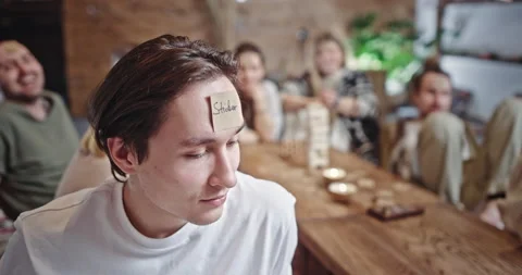 Man with Sticker label attached to his forehead. Man with Sticker label attached Stock Footage 172556086