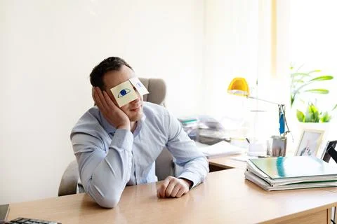 Man, sticky notes and sleeping in office, exhausted and professional Stock Photos