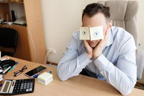 Man, sticky notes and sleeping in office, exhausted and professional Stock Photos