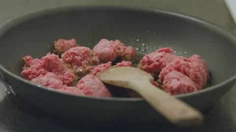 Man Stirring Beef as it Cooks on the Stovetop Stock Footage 91226318