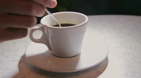 Man stirring coffee, close-up, shallow DOF Stock Footage 60604081