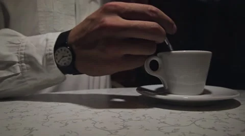 Man stirring coffee, close-up, shallow DOF Stock Footage 60604300