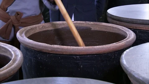 Man stirring liquid into huge container Stock-Footage 88825735
