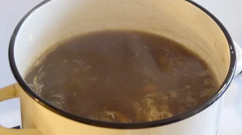Man Stirring the Soup by Spoon 動画素材 42563630