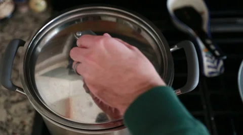 Man stirring spaghetti sauce Stock Footage 32820712