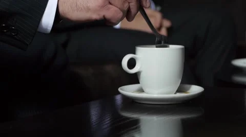 Man Stirs Coffee 库存影片 53251774
